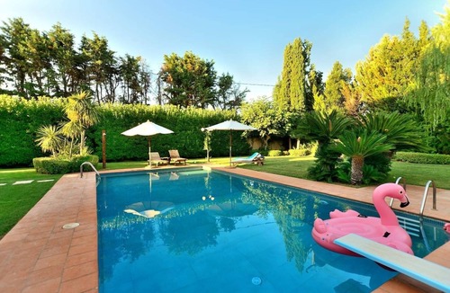 Skala Oropou Villa | Pool Villa Desmira Dive in the pleasure and relax by the pool, close to the sea.