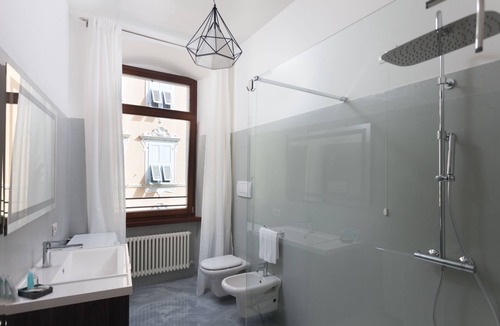 Riva del Garda Apartment | Stylish Apartment "RivApartmentsDowntowN - Travel" with a View of the Old Town of Riva del Garda, A/C & Wi-Fi