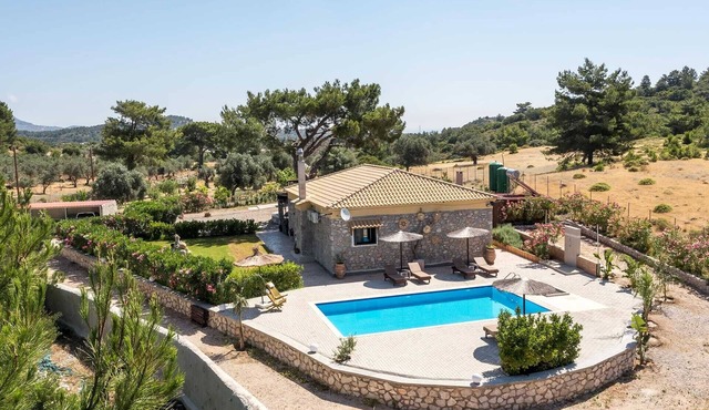 illa in the Woods is a stunning stone-and-wood property in Kolympia area.