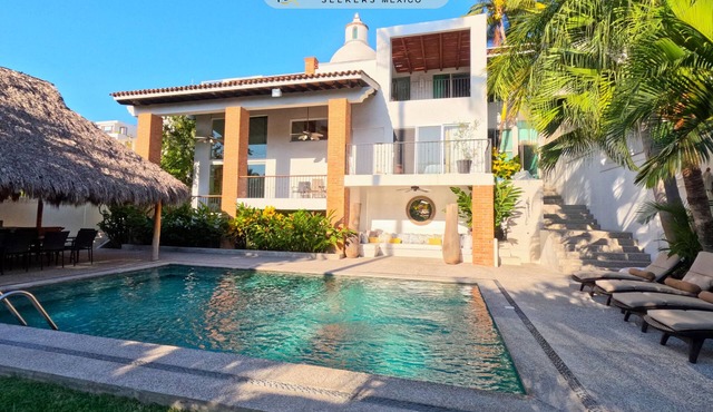 Steps from the beach, pool, games room and privacy!